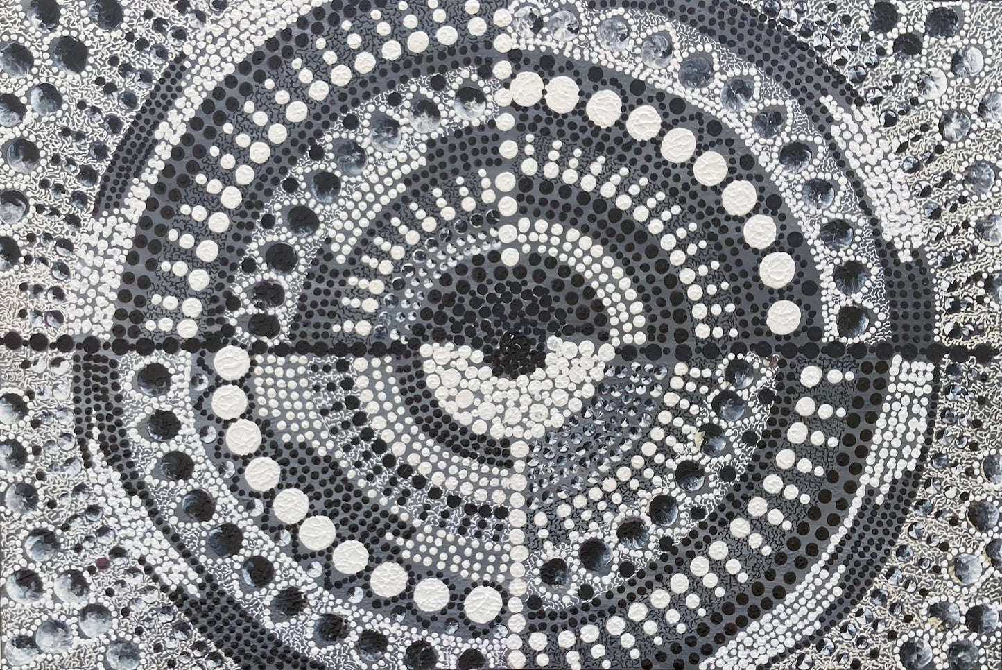 Contemporary Aboriginal dot art in symmetrical mandala design in Black and White
